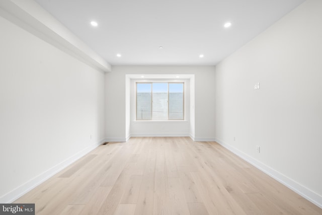 unfurnished room with light hardwood / wood-style flooring