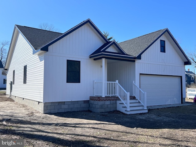 view of front of house featuring crawl space, roof with shingles, and an attached garage