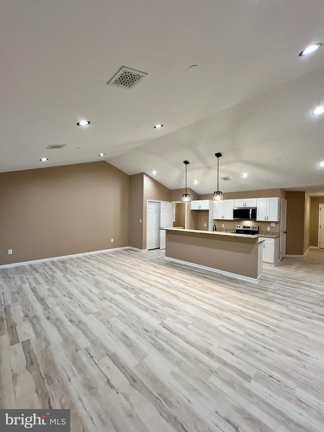 kitchen featuring open floor plan, visible vents, and appliances with stainless steel finishes