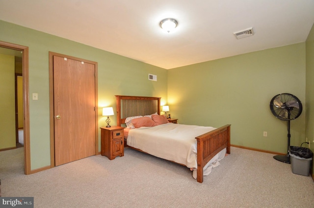 bedroom with light carpet