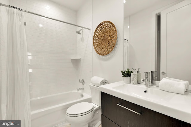 full bathroom featuring vanity, shower / bath combination with curtain, and toilet