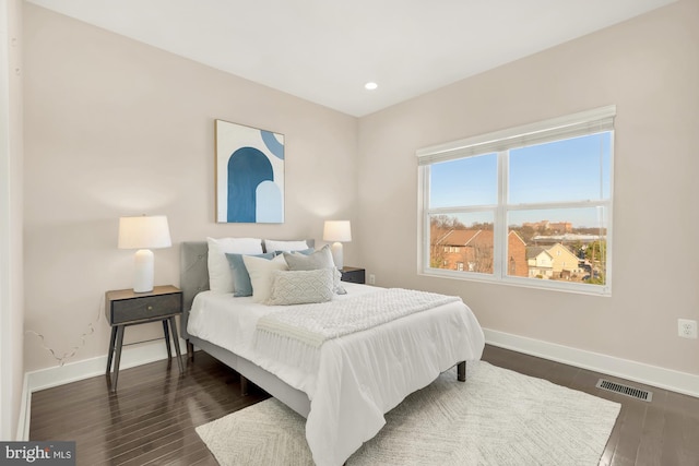 bedroom featuring dark hardwood / wood-style floors