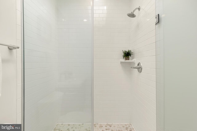 bathroom with tiled shower