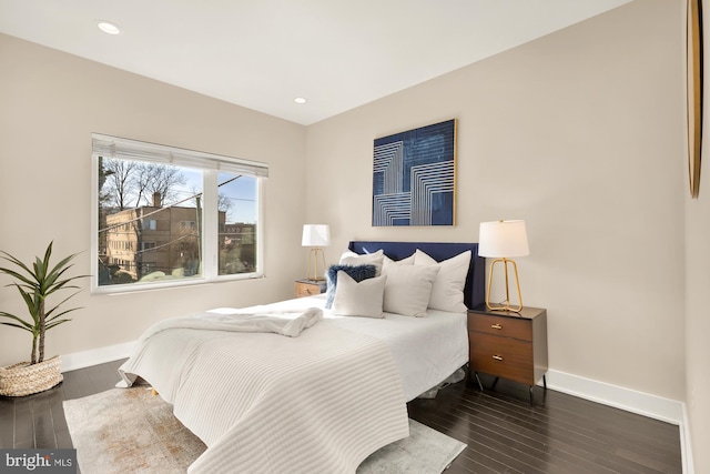 bedroom featuring dark hardwood / wood-style flooring