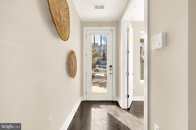 entryway with dark wood-type flooring