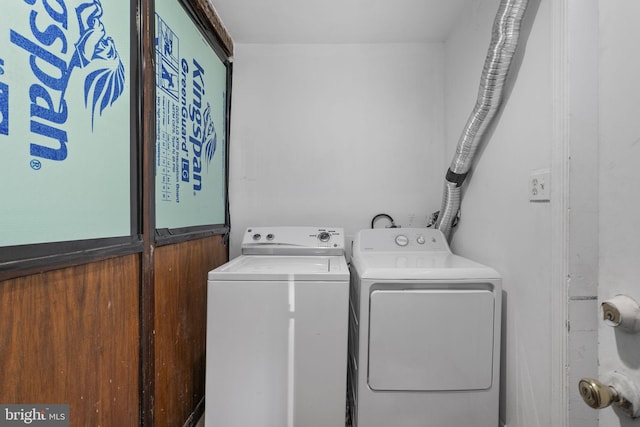 washroom with independent washer and dryer