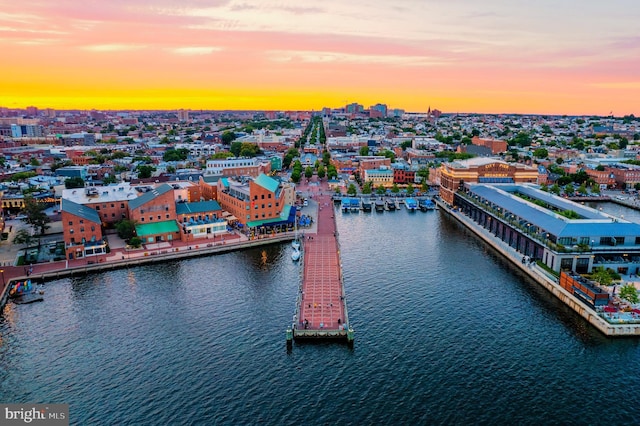 aerial view at dusk with a water view