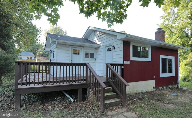 rear view of property with a deck