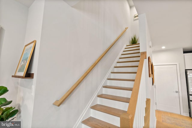 staircase featuring hardwood / wood-style flooring