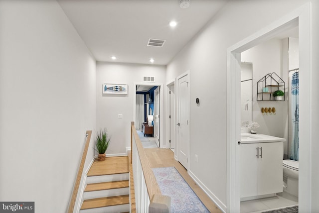 hallway featuring light hardwood / wood-style flooring