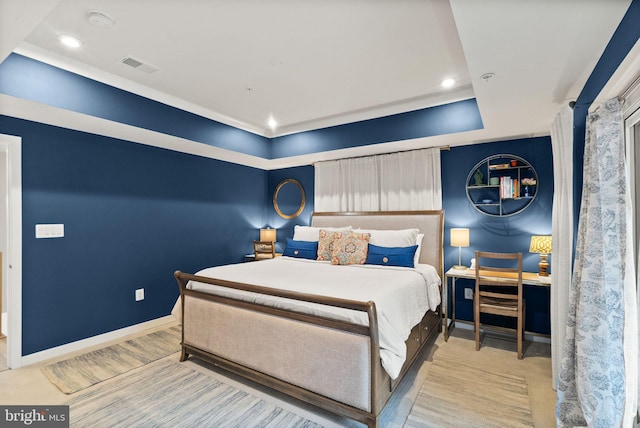 bedroom featuring a raised ceiling