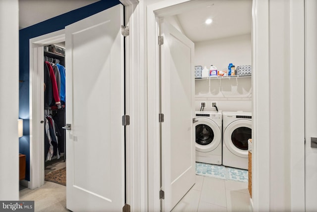 washroom featuring washer and dryer and light tile patterned floors