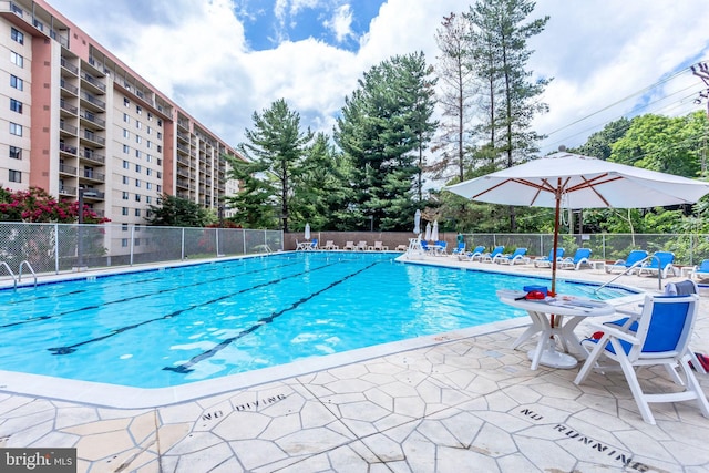 view of swimming pool featuring a patio area