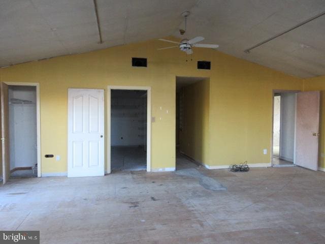 unfurnished bedroom with lofted ceiling and ceiling fan