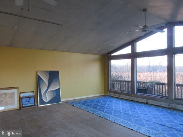 additional living space with ceiling fan and a healthy amount of sunlight