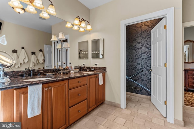 bathroom with vanity and an inviting chandelier