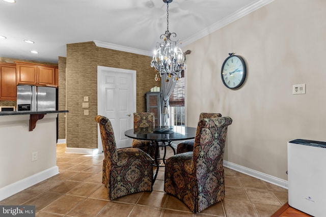 dining room featuring crown molding, a chandelier, and light tile patterned flooring