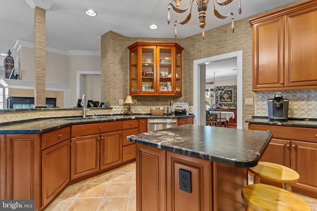 kitchen featuring sink, light tile patterned floors, dishwasher, an inviting chandelier, and a kitchen island