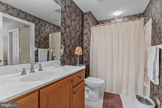 bathroom with a shower with curtain, vanity, tile patterned floors, and toilet