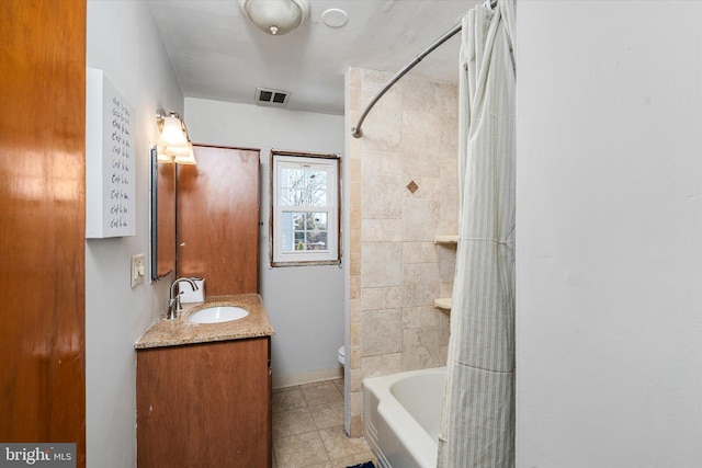 full bathroom featuring shower / tub combo with curtain, vanity, and toilet