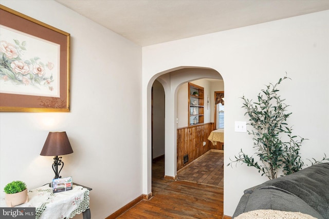 hallway featuring dark wood-type flooring