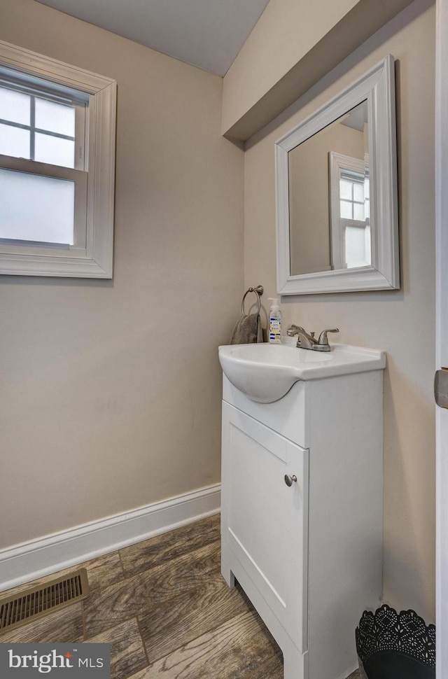 bathroom with a wealth of natural light and vanity