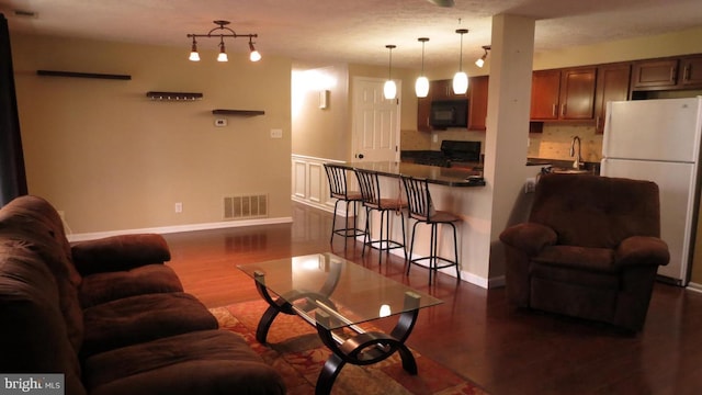 living room with dark hardwood / wood-style floors