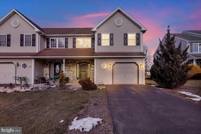 front of property with a garage