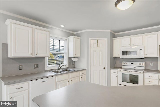 kitchen with white appliances, white cabinets, ornamental molding, and sink