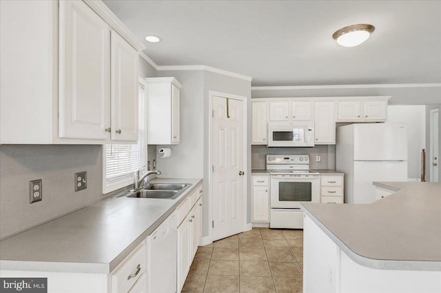 kitchen featuring white appliances, white cabinetry, light tile patterned flooring, and sink