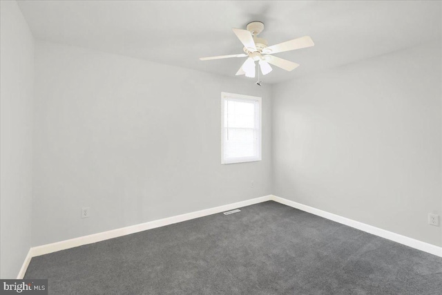 carpeted empty room with ceiling fan