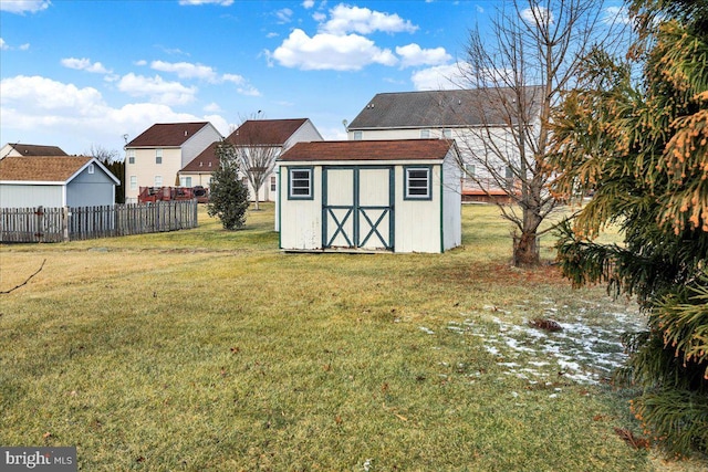 view of yard with a storage unit