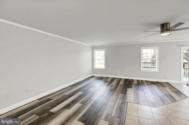 spare room with ornamental molding, ceiling fan, and hardwood / wood-style flooring