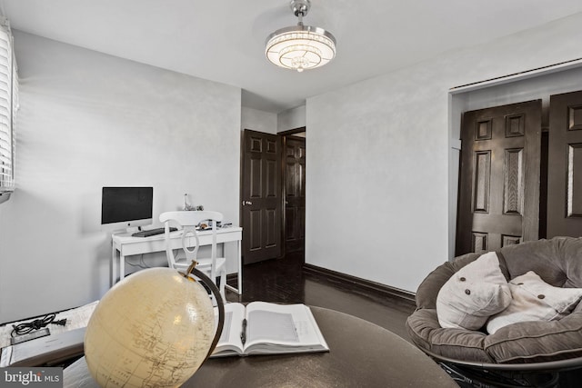 office with dark hardwood / wood-style flooring