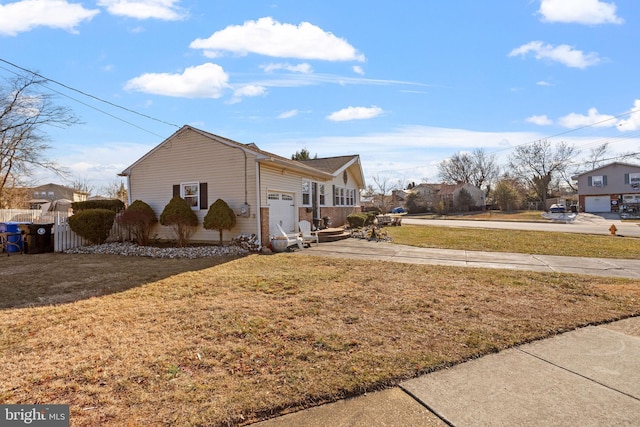 view of side of property with a lawn