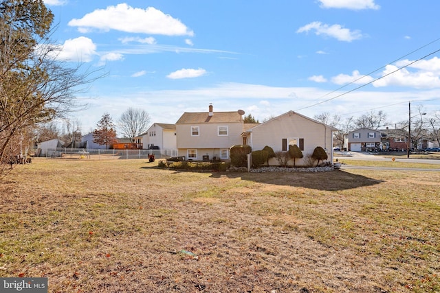 view of side of home with a lawn