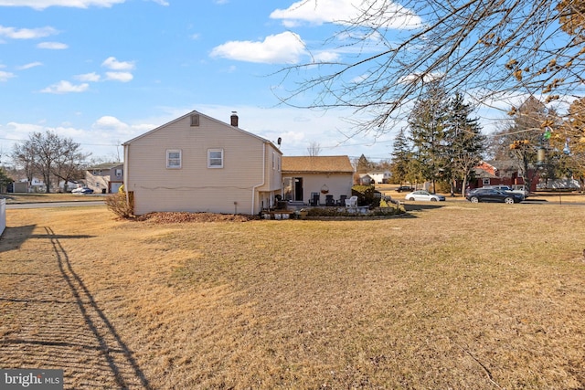 view of home's exterior featuring a yard