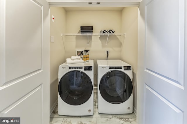 laundry room with separate washer and dryer