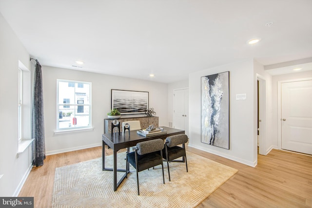 office space with light wood-type flooring