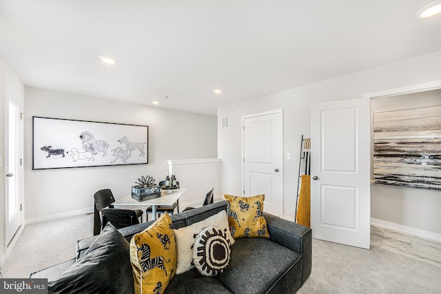 living area with light carpet