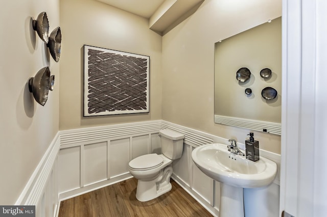 bathroom featuring toilet and hardwood / wood-style flooring