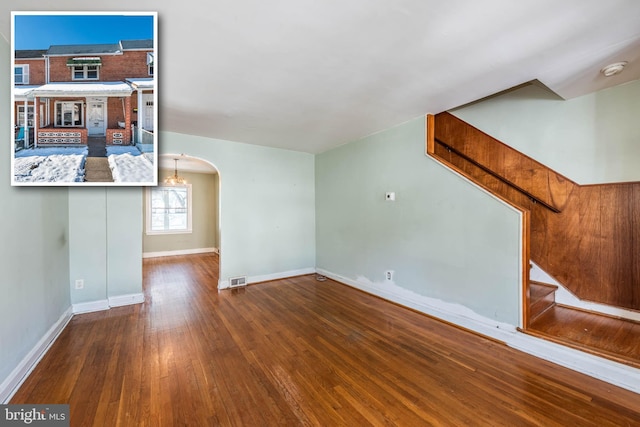 unfurnished living room with wood-type flooring