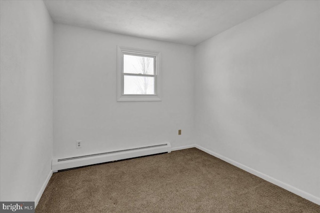 carpeted spare room featuring baseboard heating