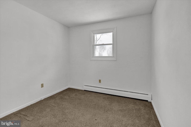 unfurnished room featuring carpet floors and a baseboard heating unit