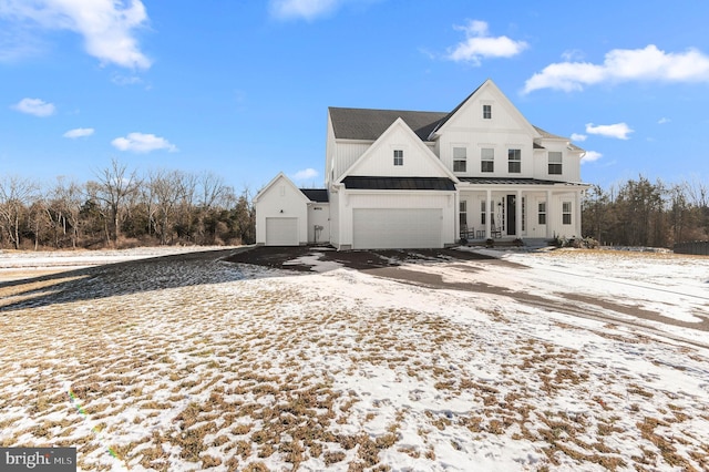 view of front of house featuring a garage and a porch