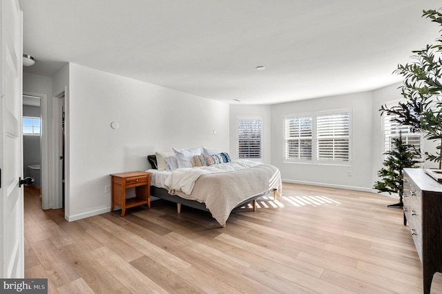 bedroom with light hardwood / wood-style flooring