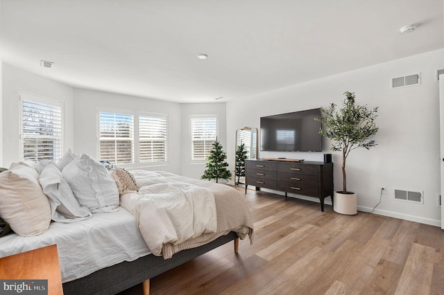 bedroom with light hardwood / wood-style floors