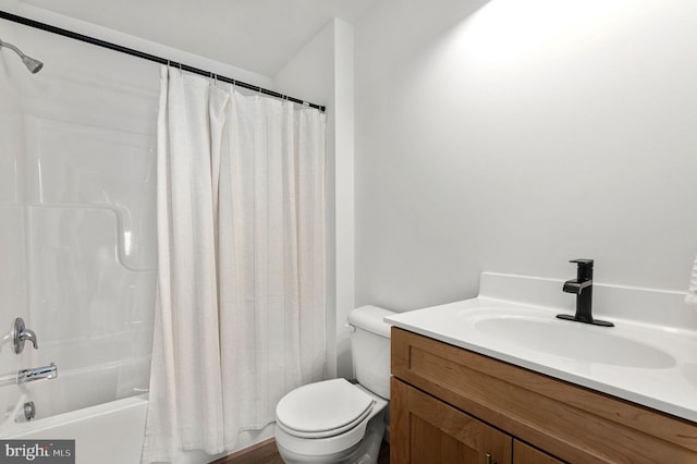 full bathroom featuring toilet, vanity, and shower / bathtub combination with curtain