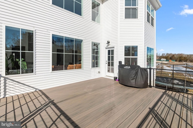 wooden terrace featuring grilling area