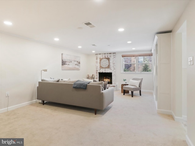 carpeted living room featuring a fireplace